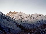 101 Ridge From Annapurna Northwest Face To Past Fang Sunrise From Thulo Bugin River Camp Our Thulo Bugin River Camp had a light covering of snow in the morning with the Northwest face of Annapurna to Fang slightly covered in early morning fog.